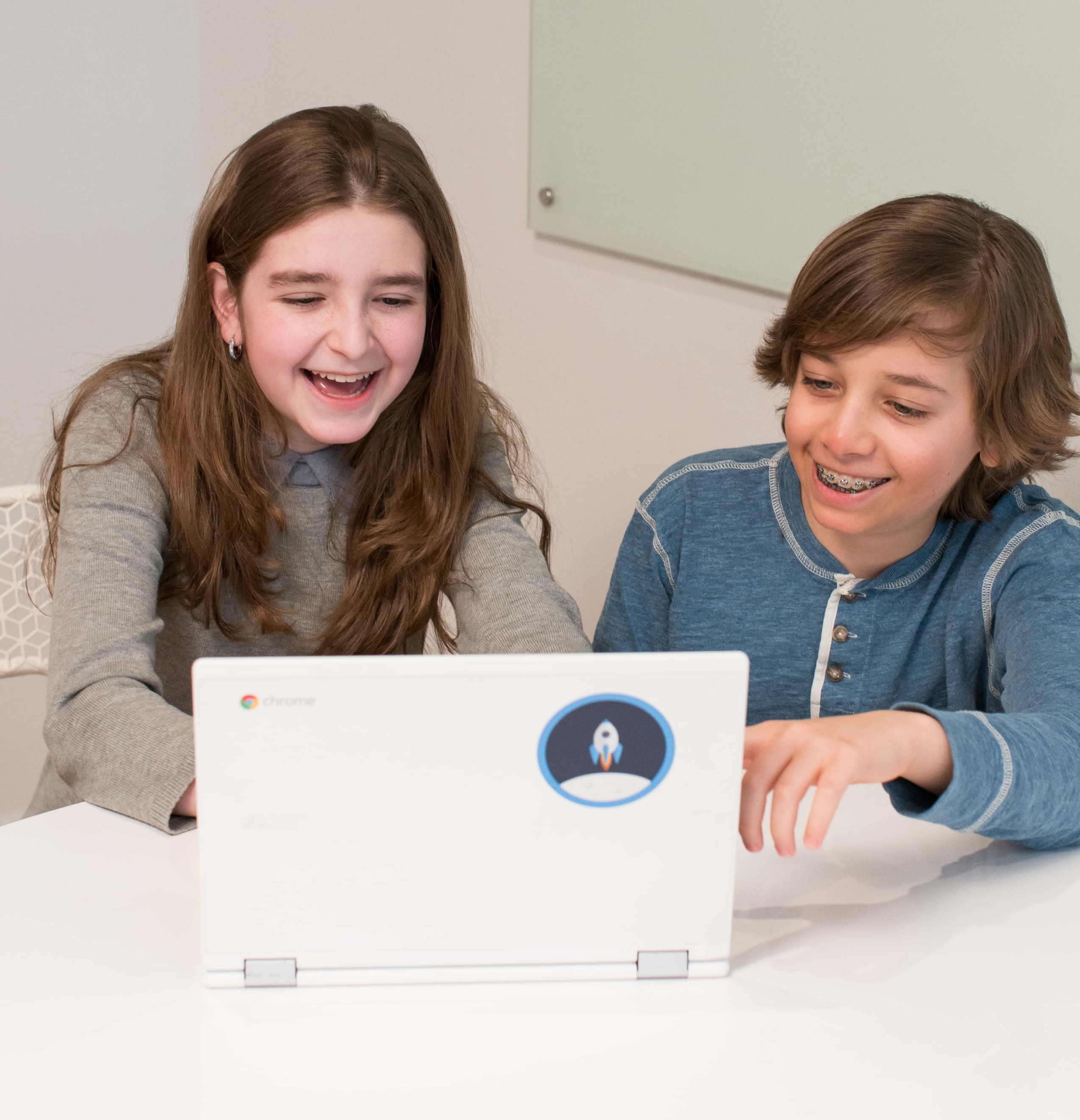 Kids coding on a computer