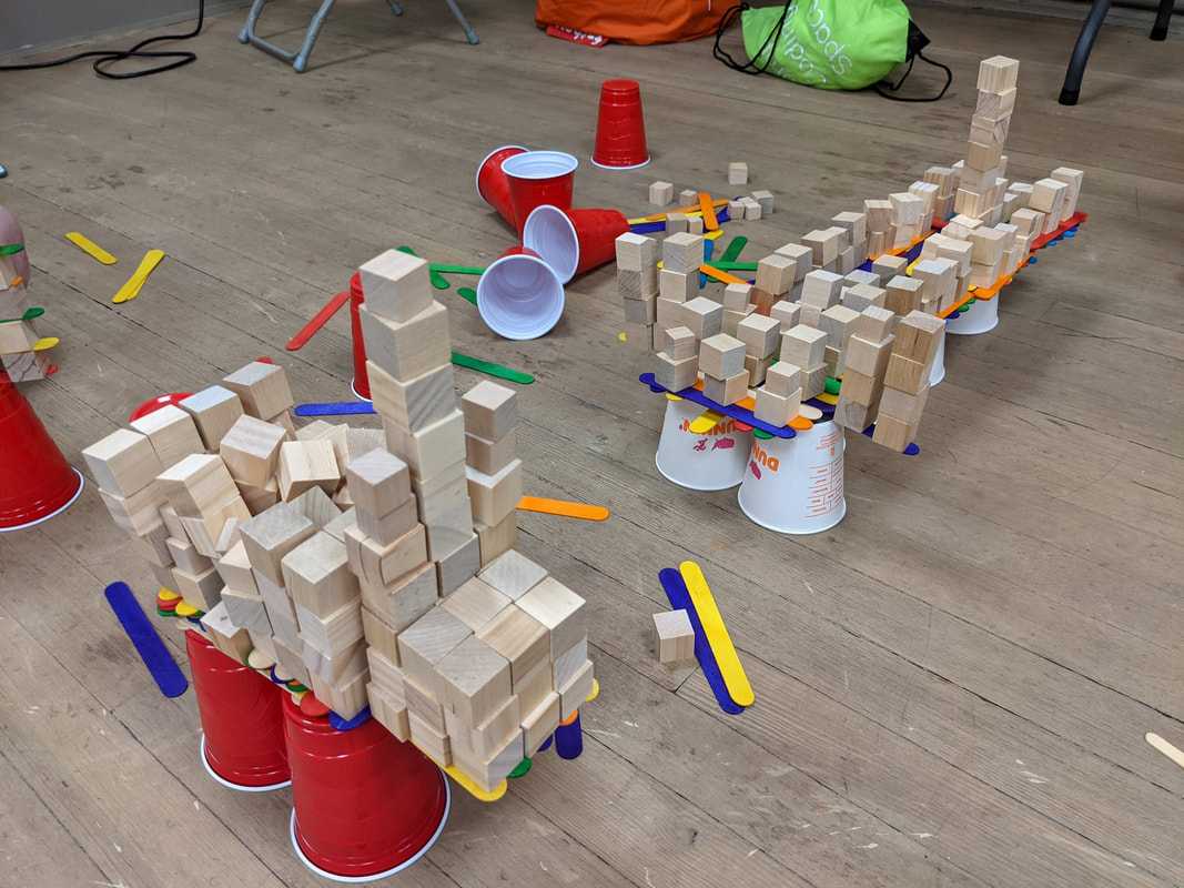 Wooden block stacking competition at a TCS camp