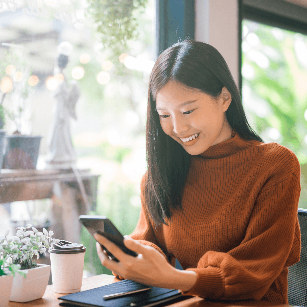 Woman looking down at her phone