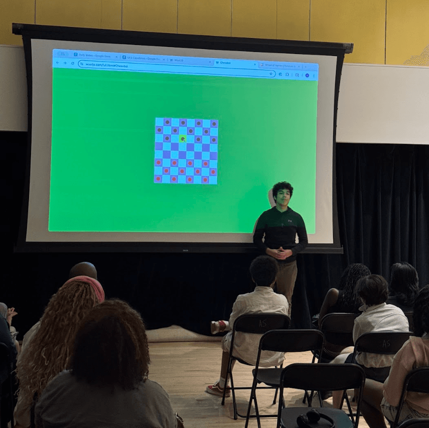 Two teenagers coding