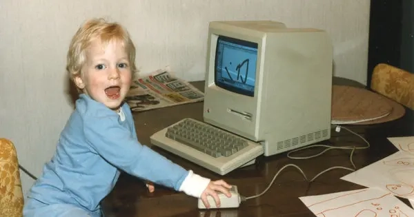A 3-year-old playing with his Macintosh 128K, 1989