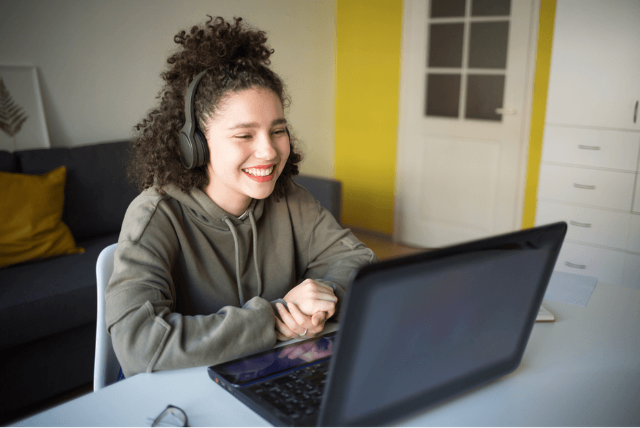 Girl smiling at computer